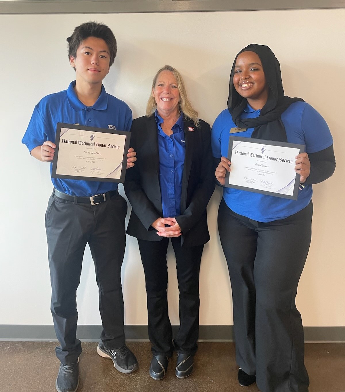 Academy seniors Ethan Tomlin and Asia Genawi, with Associate Lecturer of Computer Science Susie Cunningham.