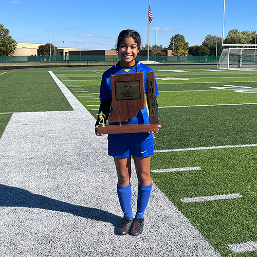 Kylani Edge with soccer trophy