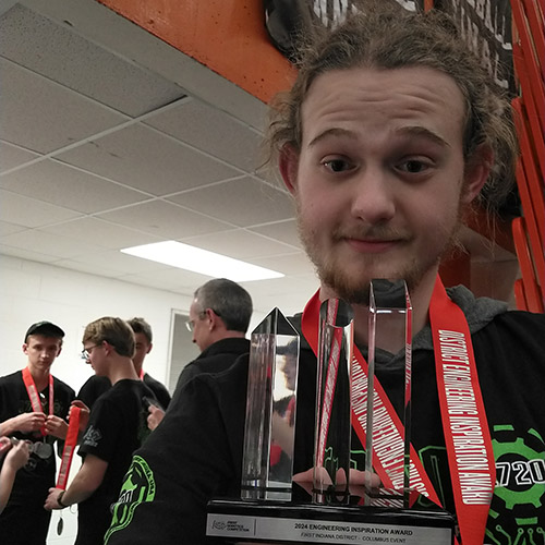 Logan with engineering trophy