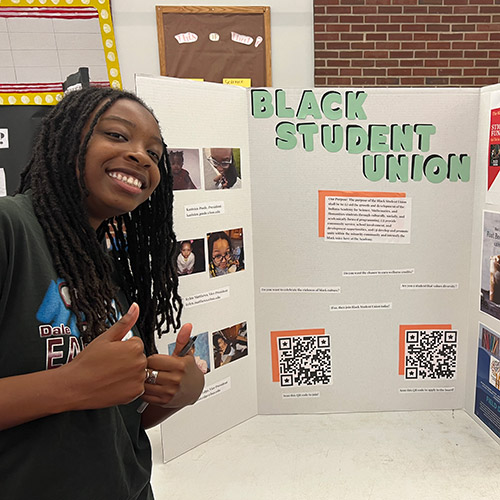 Karisten Poole with Black Student Union display